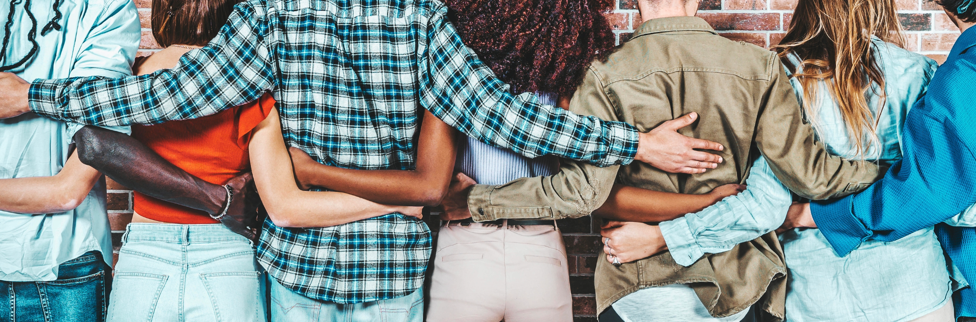 Group of friends with arm around each other showing goodwill